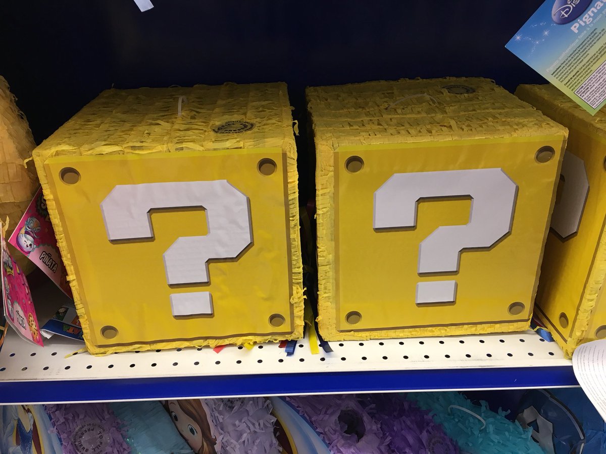 Piñatas shaped like a Super Mario question block.