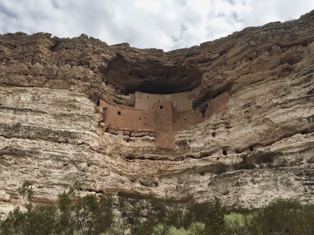 An ancient Native American dwelling built into the side of a cliff, called Montezuma Castle