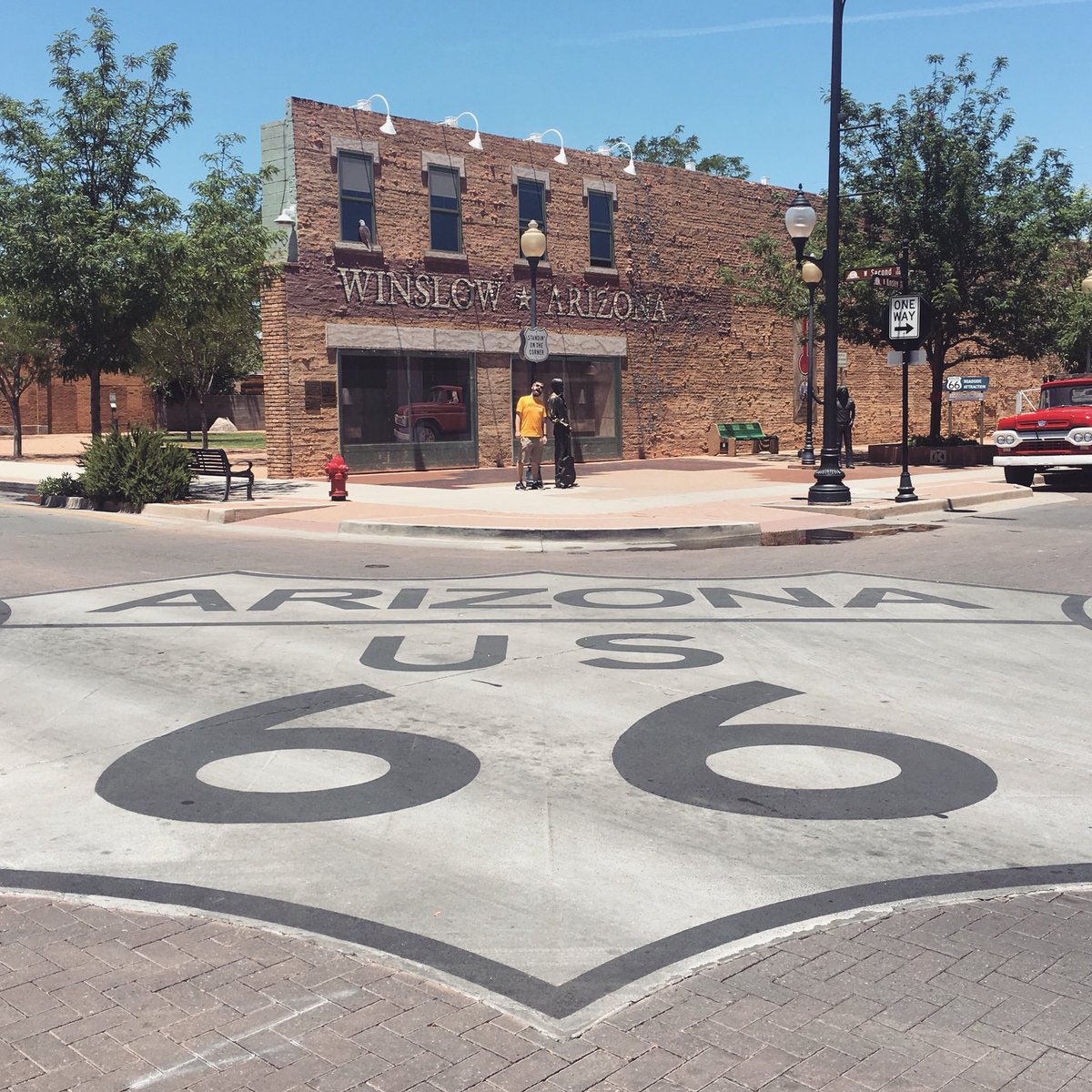 An intersection in Winslow, Arizona with a big Route 66 painted on the road