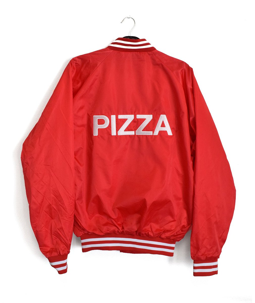 A red, satin jacket with PIZZA embroidered on the back.