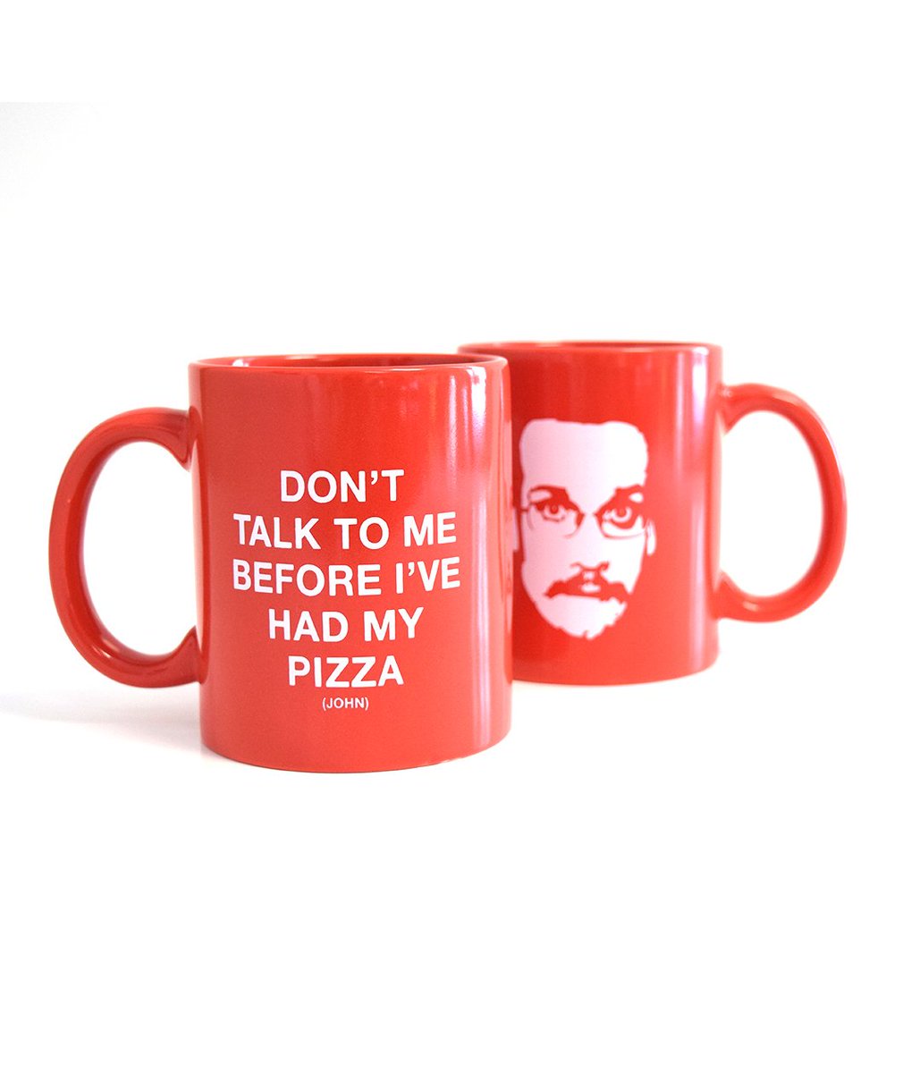 A red coffee mug with Pizza John face image and “Don’t talk to me before I’ve had my Pizza (John)” text.