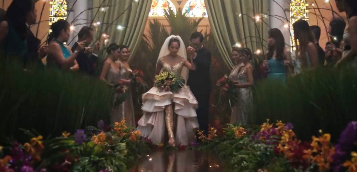 Sonoya Mizuno walking down the aisle in Crazy Rich Asians.