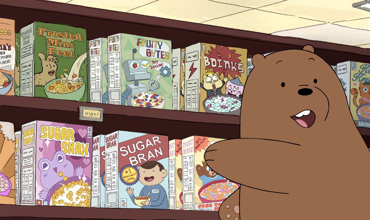 A We Bare Bears screencap: Grizz (a grizzly bear) points at a shelf of cereal boxes. One has an anthropomorphic foot mascot and is called Frosted Mini Feet.