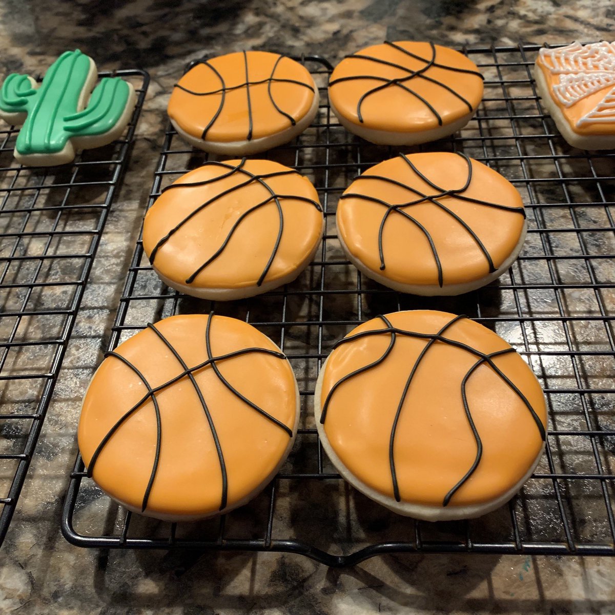 Iced sugar cookies that look like little basketballs.