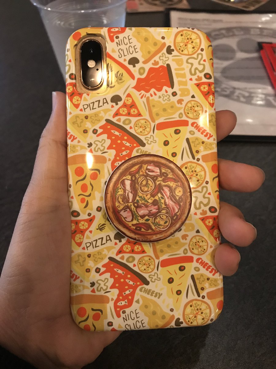 iPhone with a pizza case and pizza pop socket.