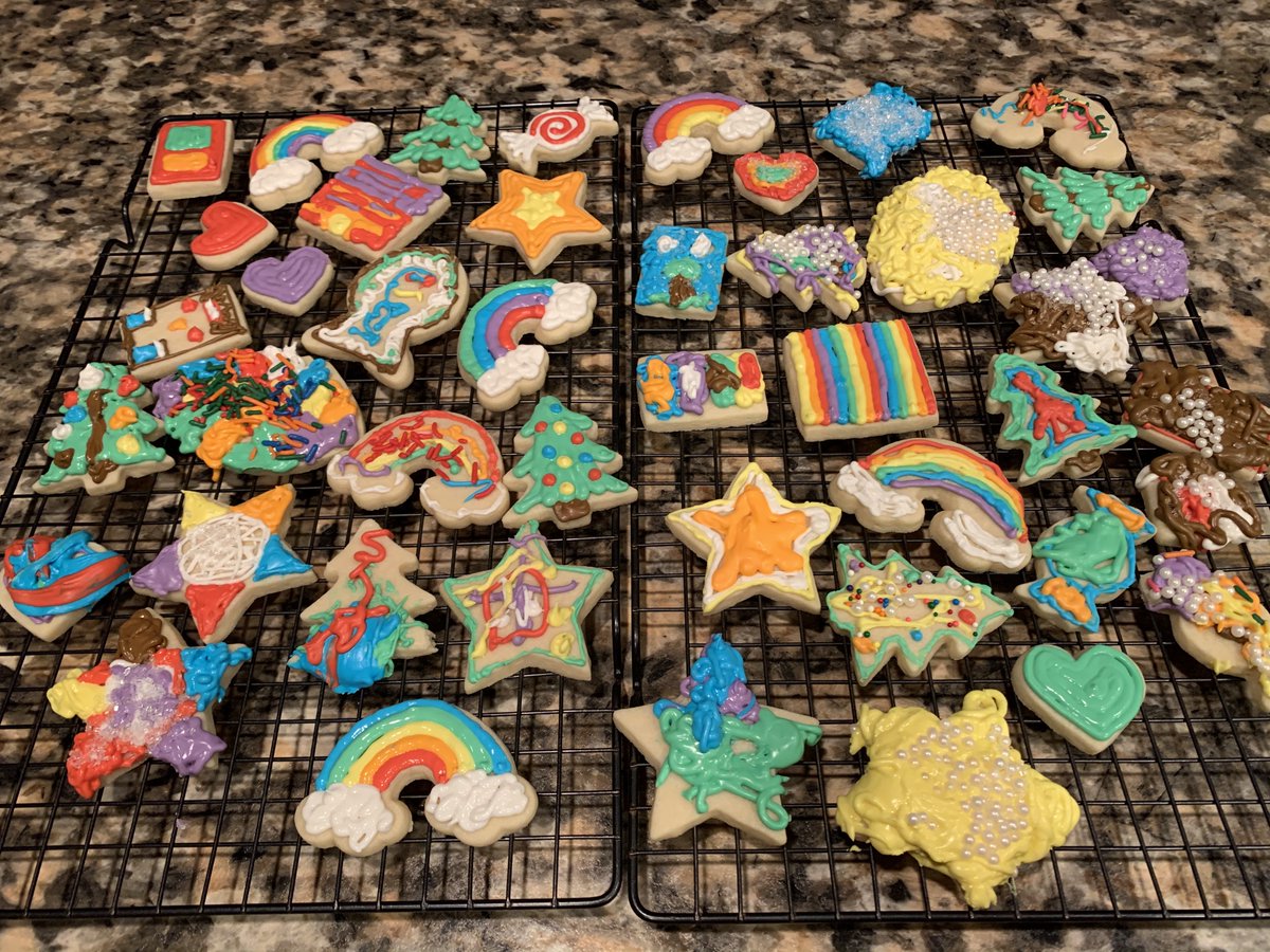 A variety of iced sugar cookies decorated with rainbow icing.