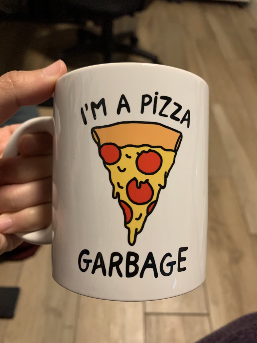 Coffee mug that says “I’m a pizza garbage” with a slice of pepperoni pizza.