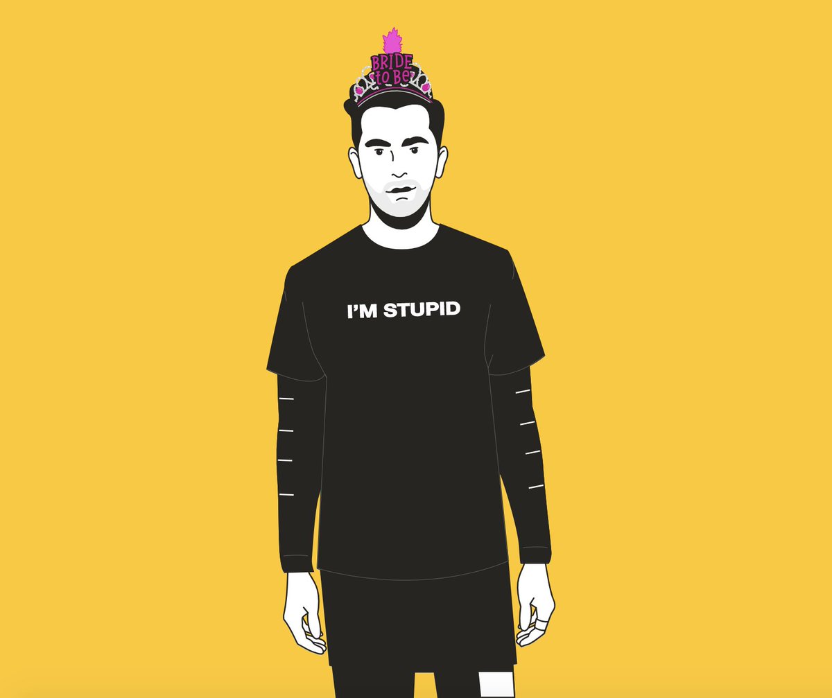 David Rose wears a black t-shirt with “I’M STUPID” in white letters and a “Bride to be” glitter tiara.