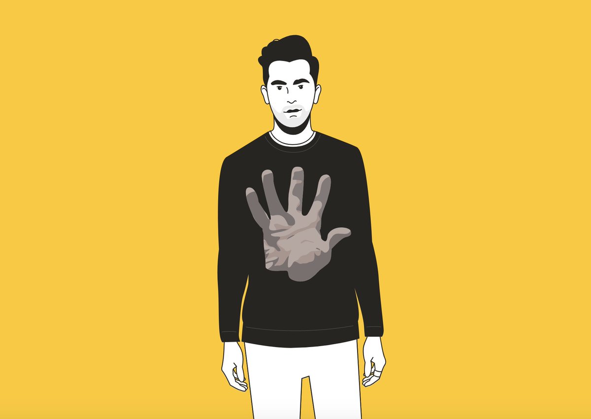 David Rose wearing a black sweater with a large open hand graphic.