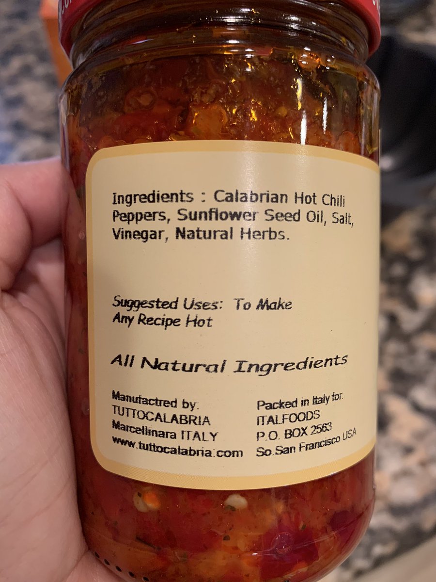 Jar of chilis, the label says Suggested Uses: To make any recipe hot.