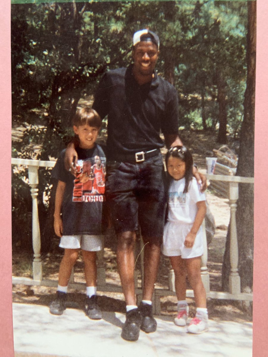 Two small kids with NBA star Cedric Ceballos.