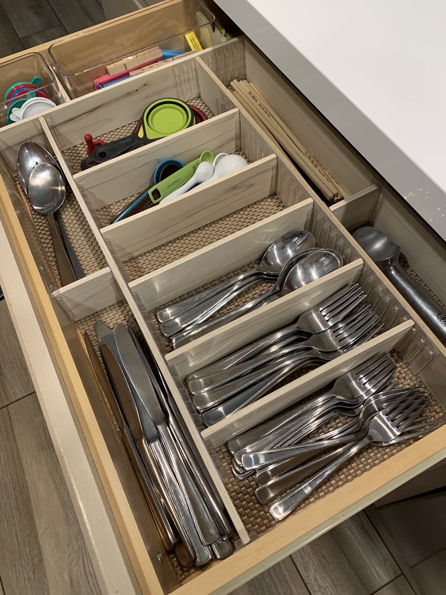 The same drawer but now filled with silverware.