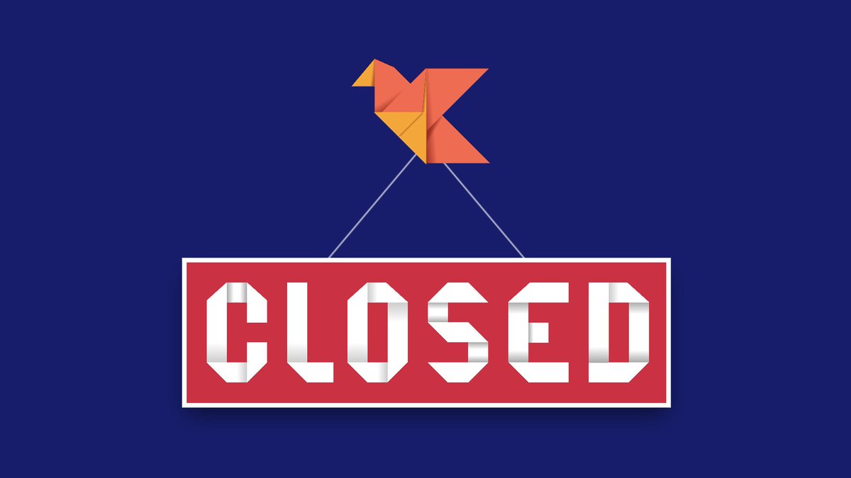 an origami bird carries a sign that says “closed” in letters constructed from folded paper