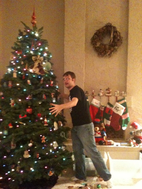 Clay hugging a big Christmas tree