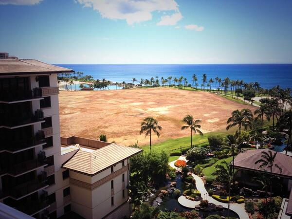 empty lot next to a Hawaiian resort right by the ocean