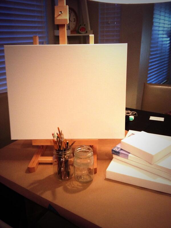 blank canvas and paintbrushes