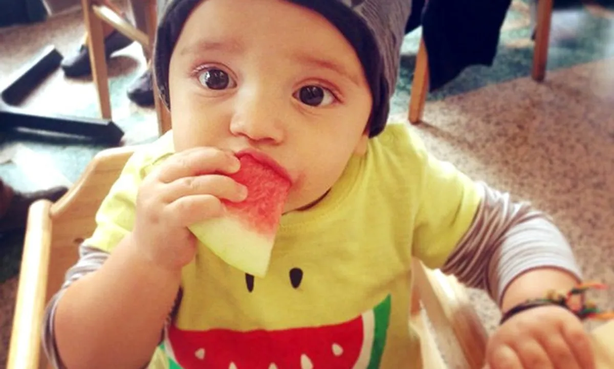 baby eating watermelon