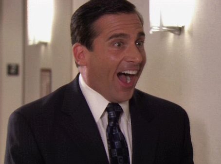 Michael Scott looking surprised and delighted