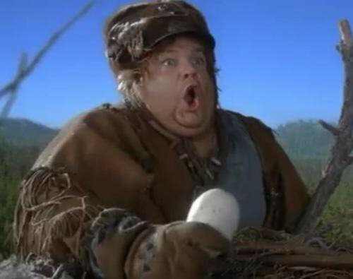 Chris Farley shocked holding an eagle’s egg from “Almost Heroes”