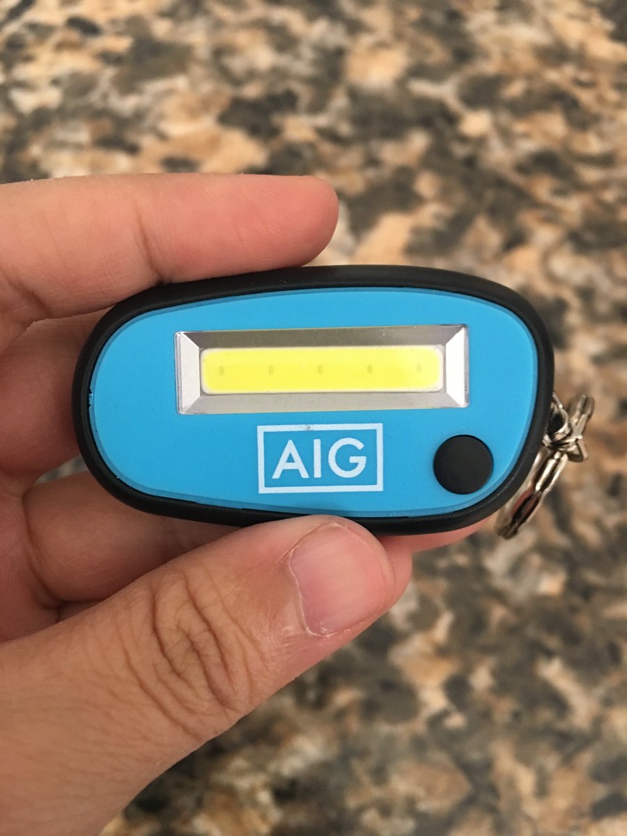 A keychain with a small button next to what looks like a small LED text display.