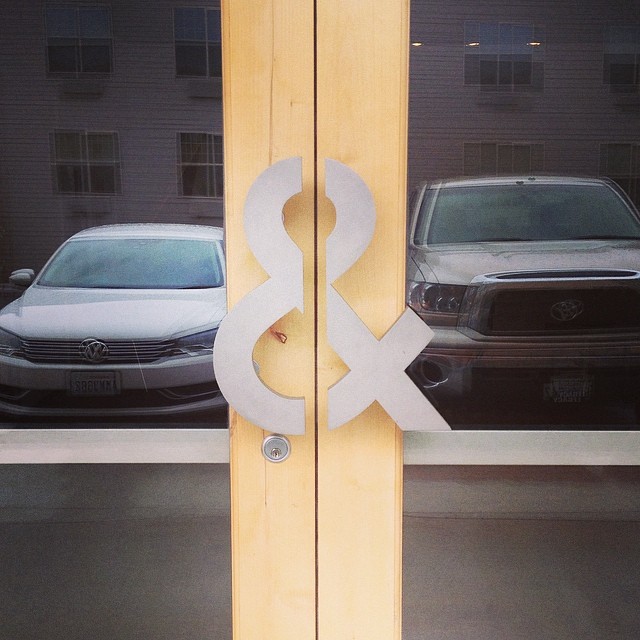 &yet’s office door with ampersand door handles