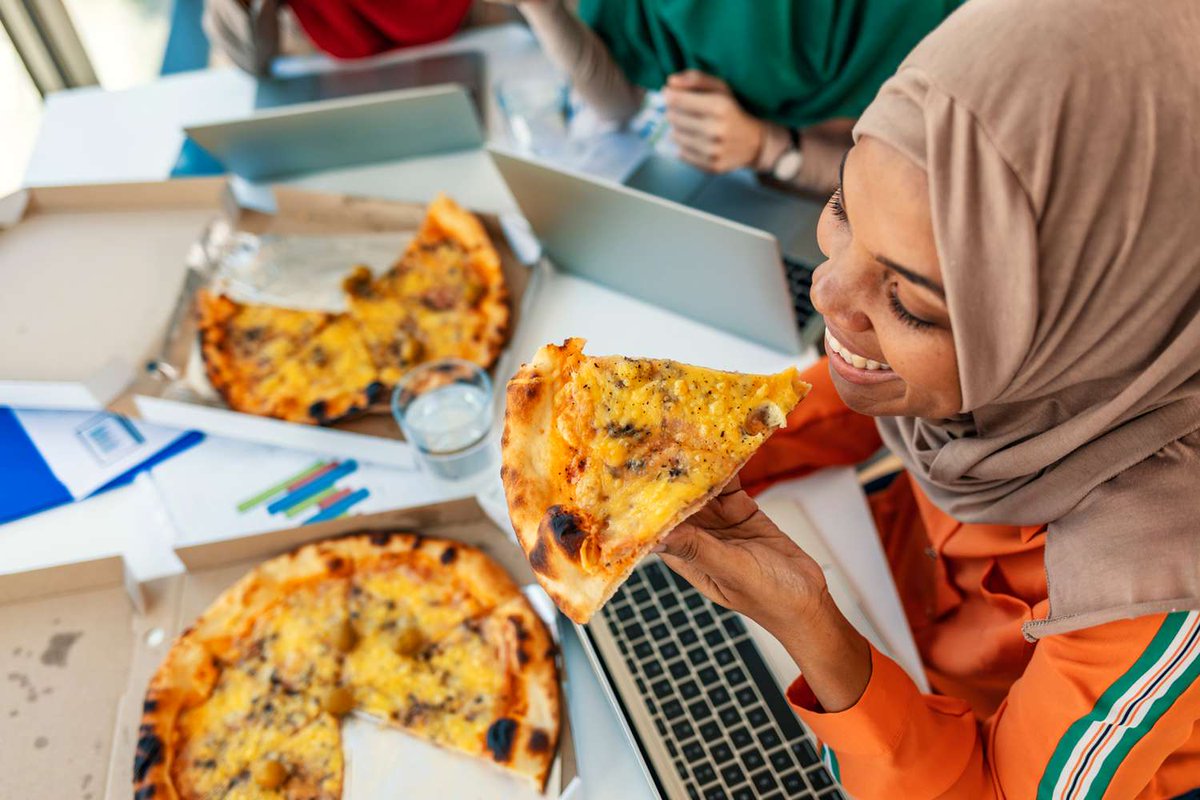 woman eating some pizza