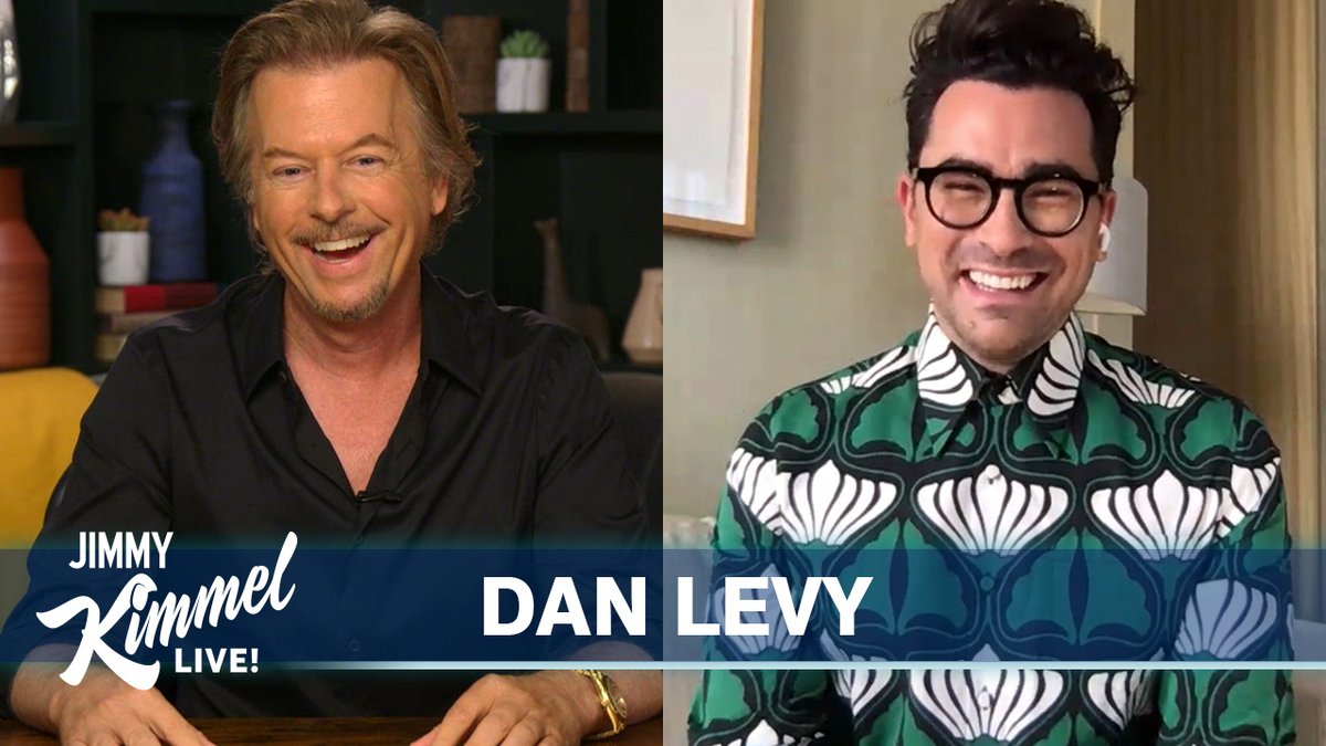 David Spade and Dan Levy who is wearing a bold patterened green, white, and black shirt