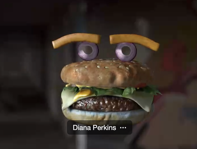 An... augmented reality? cheeseburger with onion eyeballs and french fry eyebrows.