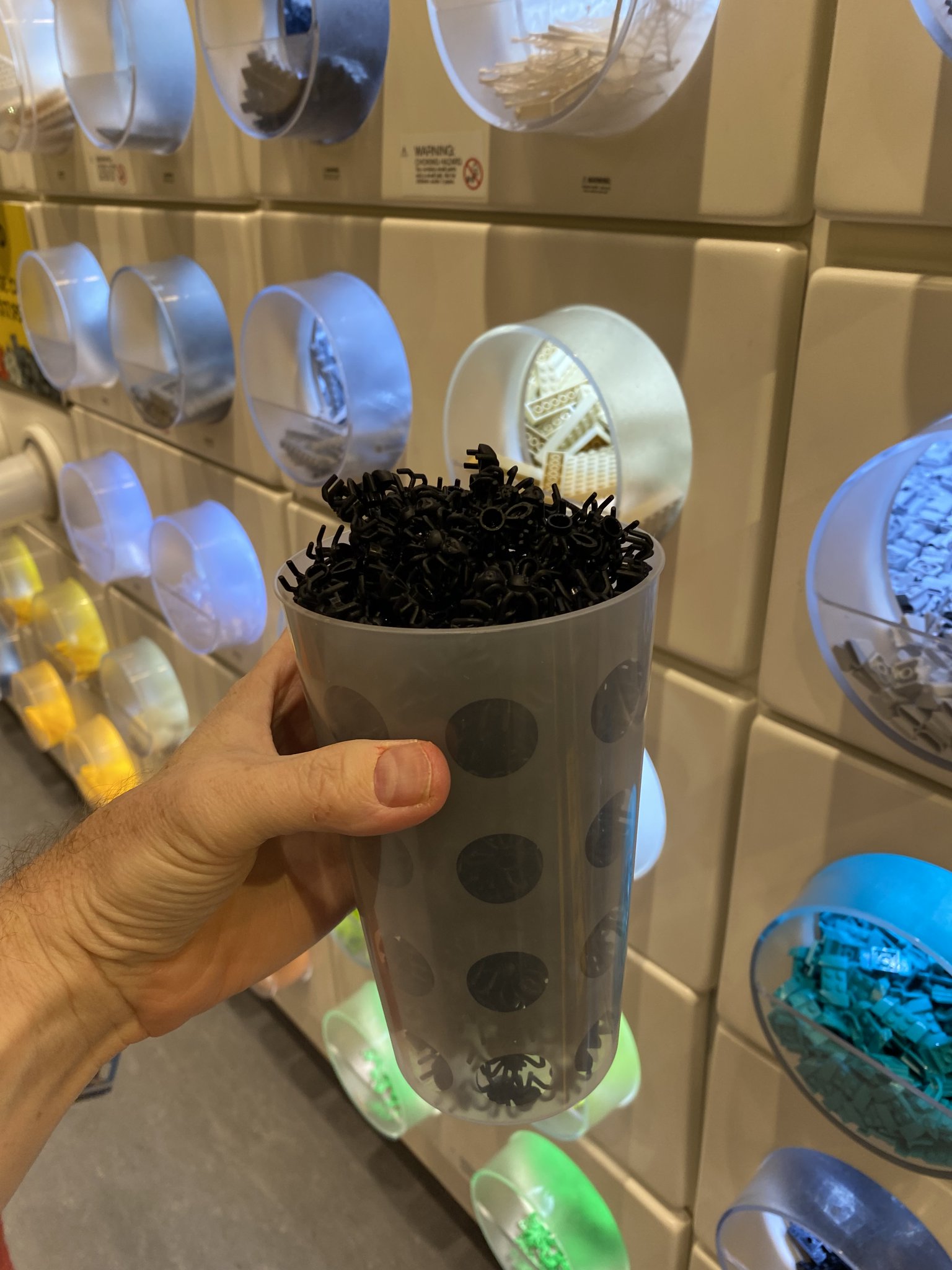 a cup full of LEGO spiders