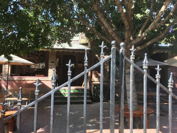 front gate to a bar patio