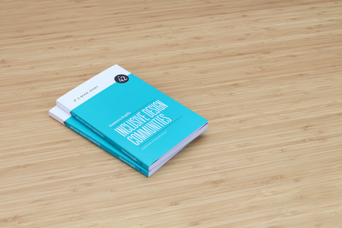 two stacked turquoise books: Inclusive Design Communities