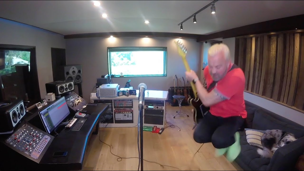 John Feldmann playing in his home studio