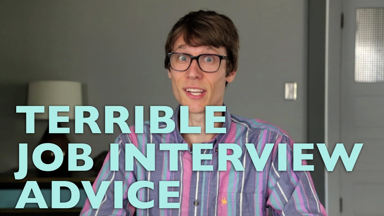 man with glasses and a pink/purple striped button-down shirt