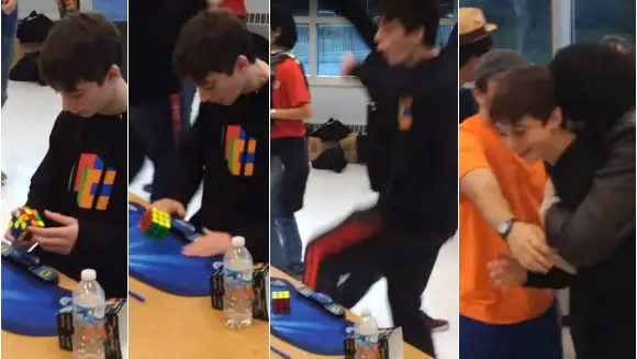 shots of Lucas solving the cube and celebrating